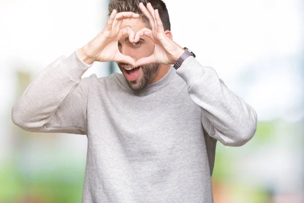 Ung Vacker Man Bär Tröja Över Isolerade Bakgrund Gör Hjärta — Stockfoto