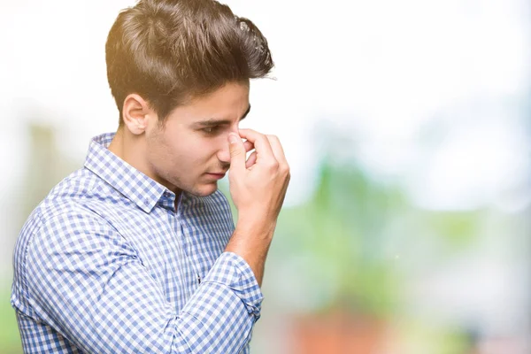 Joven Hombre Negocios Guapo Sobre Fondo Aislado Cansado Frotando Nariz — Foto de Stock