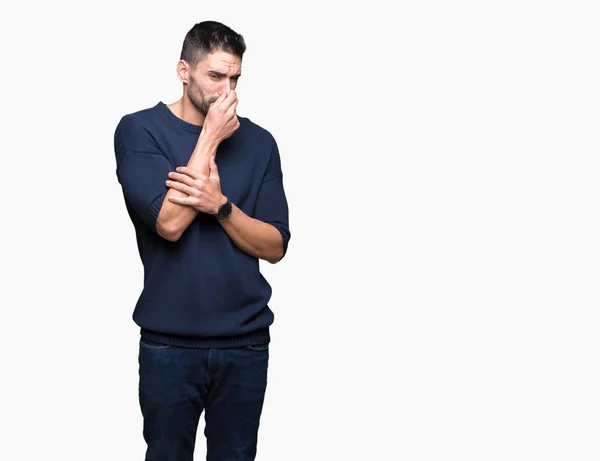 Joven Hombre Guapo Usando Suéter Sobre Fondo Aislado Oliendo Algo — Foto de Stock