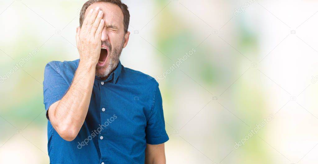 Handsome middle age elegant senior man over isolated background Yawning tired covering half face, eye and mouth with hand. Face hurts in pain.