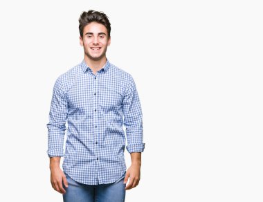 Genç yakışıklı iş adamı yüzünde mutlu ve güzel bir gülümseme ile izole arka plan üzerinde. Şanslı kişi.