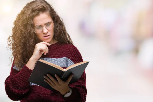 Young Brunette Girl Reading Book Wearing Glasses Isolated Background Serious — Stock Photo, Image