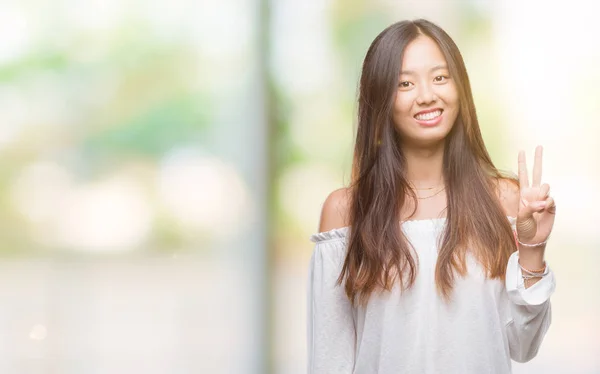 Young Asian Woman Isolated Background Showing Pointing Fingers Number Two — Stock Photo, Image