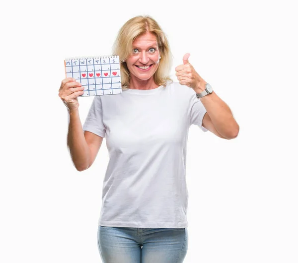 Medelålders Blond Kvinna Håller Menstruation Kalender Ver Isolerade Bakgrunden Nöjda — Stockfoto