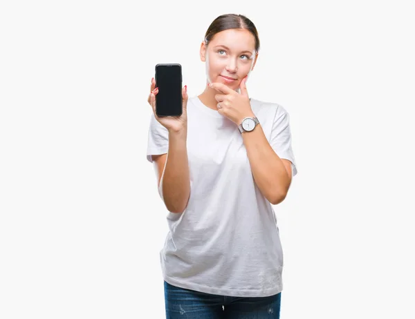 年轻美丽的高加索妇女显示智能手机屏幕在孤立的背景严重的脸思考问题 很困惑的想法 — 图库照片