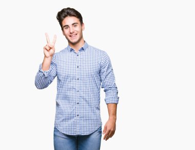 Genç yakışıklı iş adamı gösterilen ve parmakları ile işaret izole arka plan üzerinde ikincisi ise kendinden emin ve mutlu gülümseyerek.