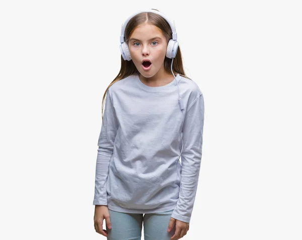 Young Beautiful Girl Wearing Headphones Listening Music Isolated Background Afraid — Stock Photo, Image