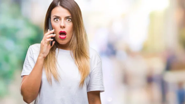 Young Beautiful Woman Speaking Calling Using Smartphone Isolated Background Scared — Stock Photo, Image