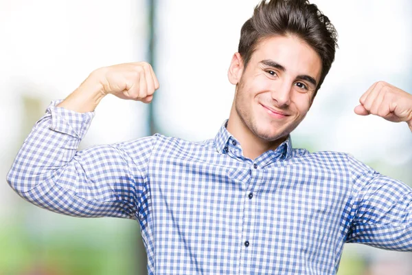 Young Handsome Business Man Isolated Background Showing Arms Muscles Smiling — Stock Photo, Image