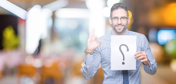 Handsome Young Business Man Holding Paper Question Mark Isolated Background — Stock Photo, Image