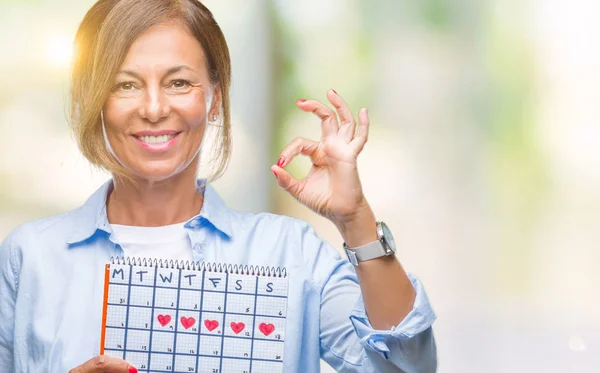 Mulher Hispânica Sênior Meia Idade Segurando Calendário Menstruação Sobre Fundo — Fotografia de Stock