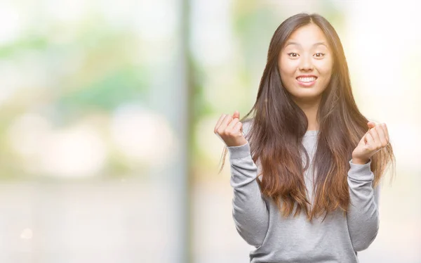 Young Asian Woman Isolated Background Celebrating Surprised Amazed Success Arms — Stock Photo, Image