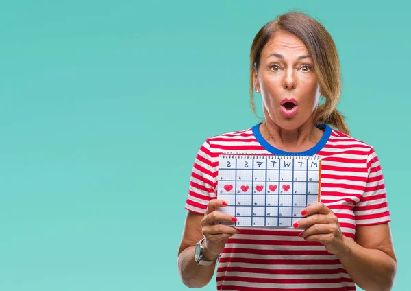 Mulher Hispânica Sênior Meia Idade Segurando Calendário Menstruação Sobre Fundo — Fotografia de Stock