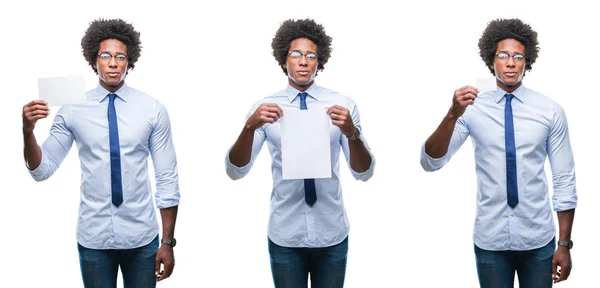 非洲裔美国青年商人拿着空白纸卡在孤立的背景与自信的表情在聪明的脸上思考严重 — 图库照片