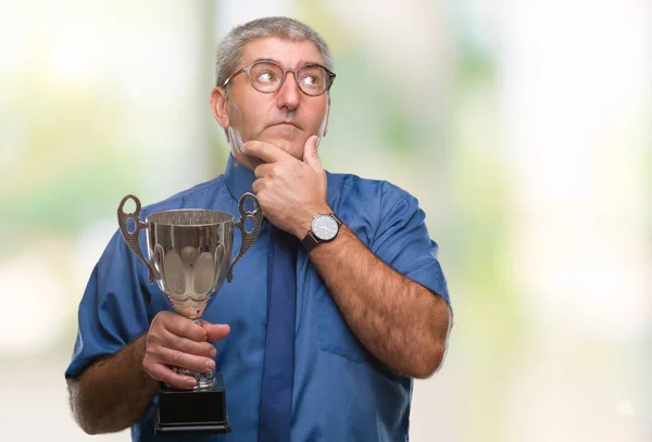 Handsome Senior Successful Man Holding Trophy Isolated Background Serious Face — Stock Photo, Image
