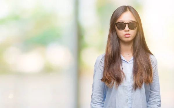 Young Asian Woman Wearing Sunglasses Isolated Background Serious Expression Face — Stock Photo, Image