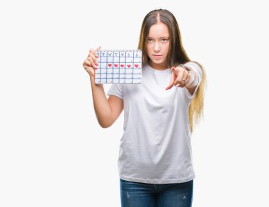 Kamera ve size parmak ile işaret arka plan beyaz kadın adet takvim holding izole, el işareti, pozitif ve kendinden emin bir jest ön