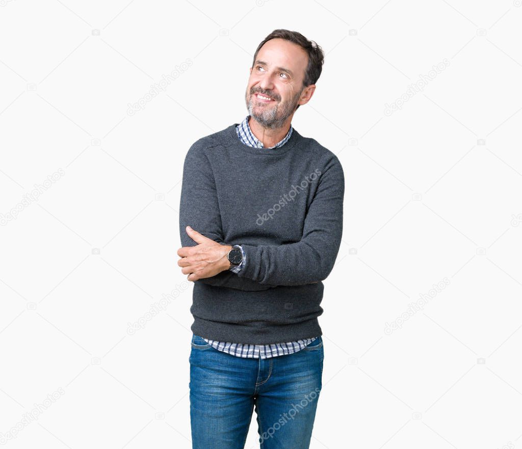 Handsome middle age senior man wearing a sweater over isolated background smiling looking side and staring away thinking.