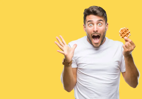 Young Handsome Man Eating Sweet Waffle Isolated Background Very Happy — Stock Photo, Image