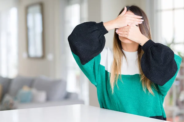 Young Beautiful Woman Wearing Winter Sweater Home Covering Eyes Mouth — Stock Photo, Image