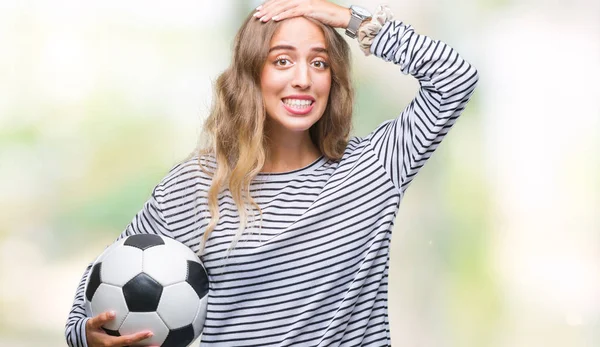 Красивая Молодая Блондинка Держащая Футбольный Мяч Изолированном Фоне Напряженная Рукой — стоковое фото
