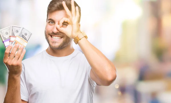 Joven Hombre Guapo Sosteniendo Pila Dólares Sobre Fondo Aislado Con —  Fotos de Stock