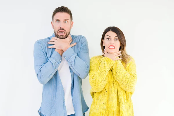 Young Beautiful Couple Togheter Isolated Background Shouting Suffocate Because Painful — Stock Photo, Image