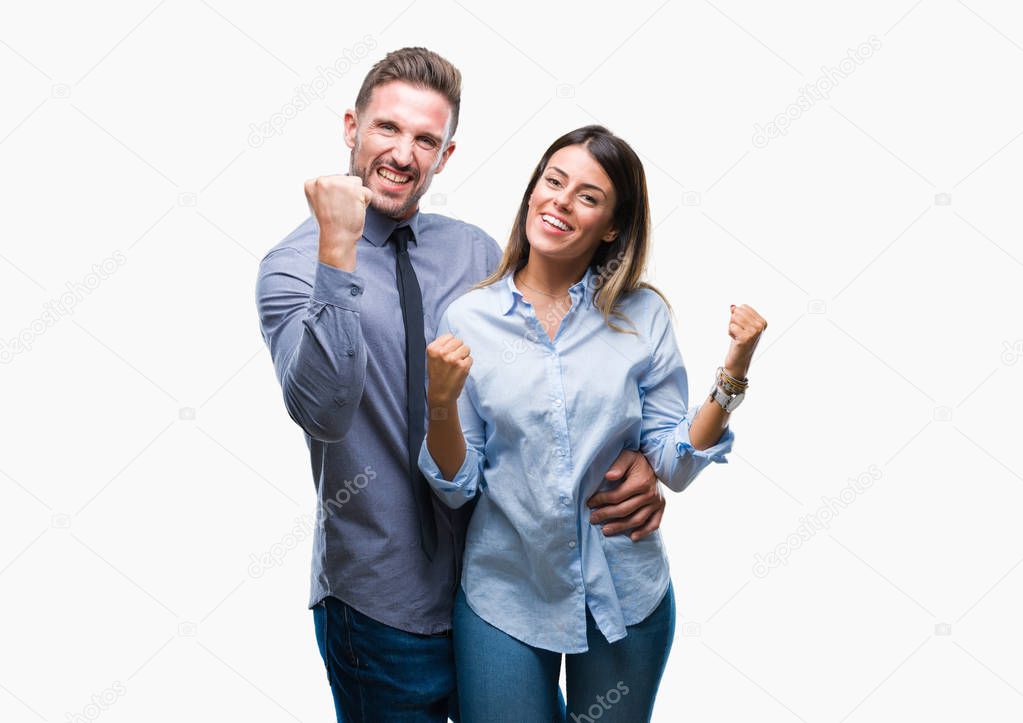 Young workers business couple over isolated background very happy and excited doing winner gesture with arms raised, smiling and screaming for success. Celebration concept.