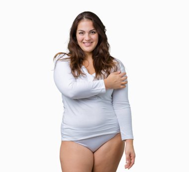 Artı boyutu genç overwight kadın güzel üzerinde beyaz iç çamaşırı giyiyor arka yüzünde mutlu ve güzel bir gülümseme ile izole. Şanslı kişi.