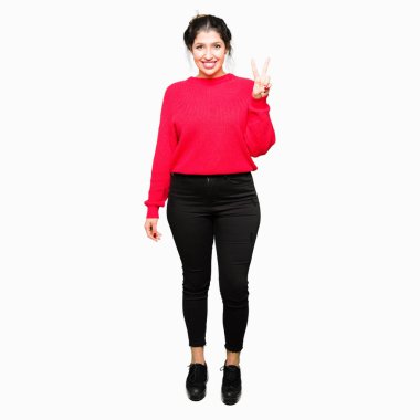 Kırmızı kazak ve gösterilen ve parmakları ile işaret topuz giyen genç güzel kadın ikincisi ise kendinden emin ve mutlu gülümseyerek.