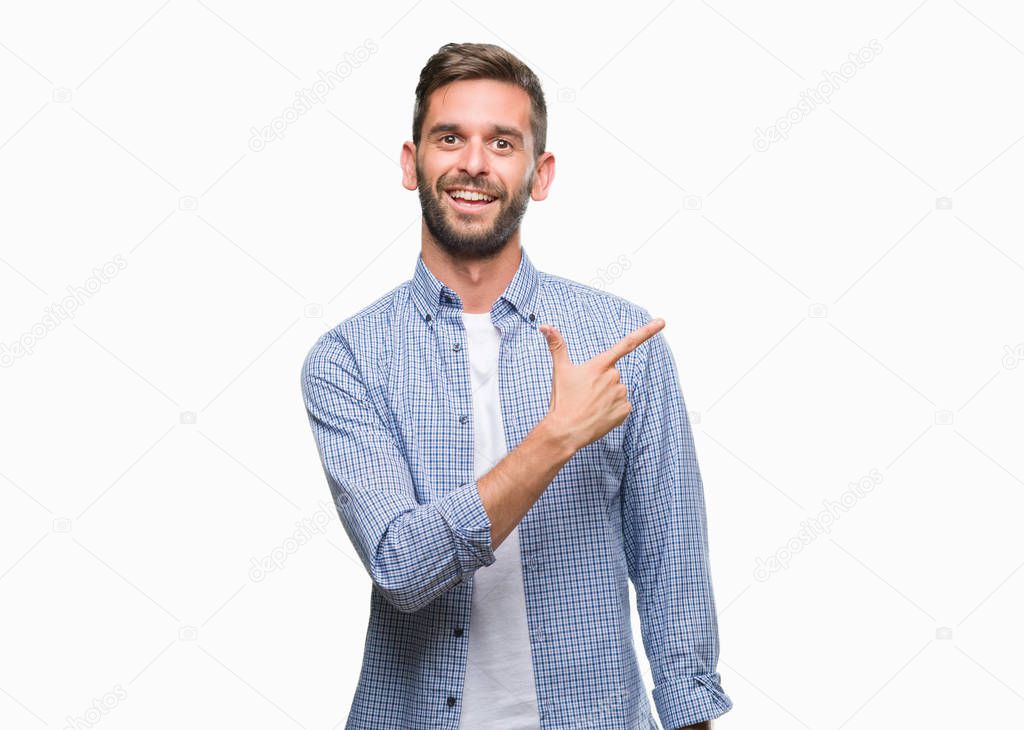 Young handsome man wearing white t-shirt over isolated background cheerful with a smile of face pointing with hand and finger up to the side with happy and natural expression on face looking at the camera.