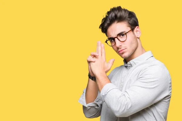 Young Handsome Man Wearing Glasses Isolated Background Holding Symbolic Gun — Stock Photo, Image