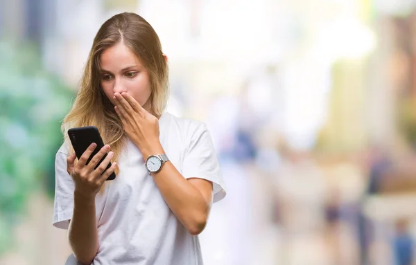 Young Beautiful Blonde Woman Using Smartphone Isolated Background Cover Mouth — Stock Photo, Image