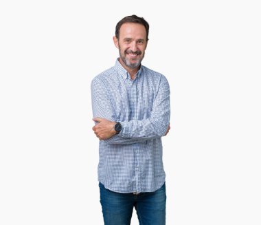 Yakışıklı orta yaş üzerinde çapraz silah kameraya bakarak ile gülümseyen izole arka plan mutlu yüz zarif komuta sizde. Olumlu bir kişi.