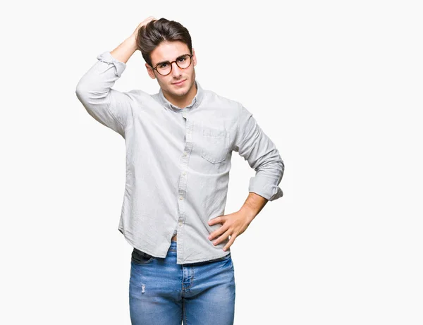 Joven Hombre Guapo Con Gafas Sobre Fondo Aislado Confundir Preguntarse — Foto de Stock