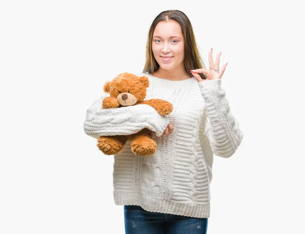 Joven Mujer Caucásica Sosteniendo Oso Peluche Sobre Fondo Aislado Haciendo —  Fotos de Stock