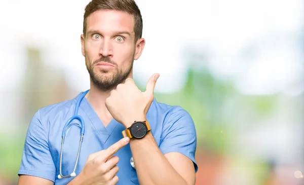 Handsome Doctor Man Wearing Medical Uniform Isolated Background Hurry Pointing — Stock Photo, Image