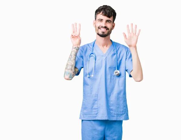 Joven Enfermero Guapo Vistiendo Uniforme Cirujano Sobre Fondo Aislado Mostrando —  Fotos de Stock