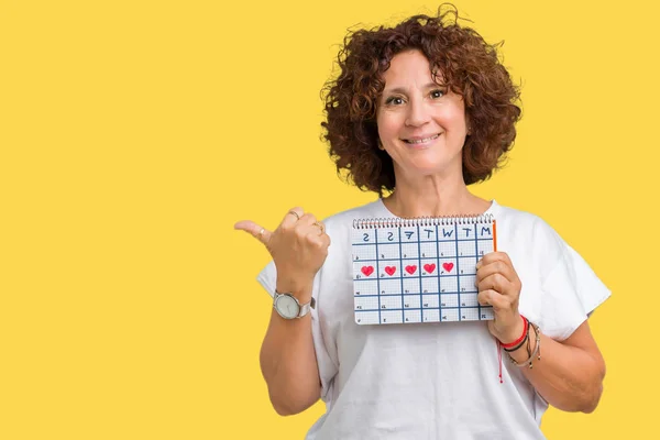 Middle Ager Senior Woman Holding Menstruation Calendar Isolated Background Pointing — Stock Photo, Image