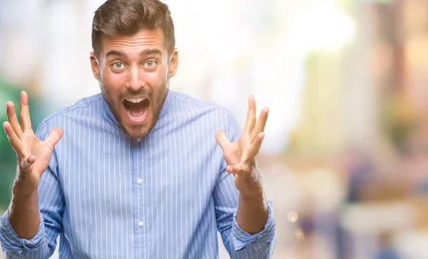 Young Handsome Man Isolated Background Celebrating Crazy Amazed Success Arms — Stock Photo, Image