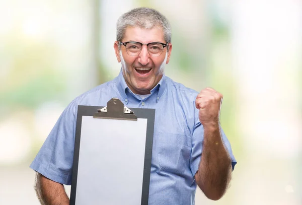 Handsome Senior Inspector Man Holding Clipboard Isolated Background Screaming Proud — Stock Photo, Image