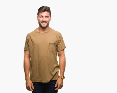 Yakışıklı delikanlı yüzünde mutlu ve güzel bir gülümseme ile izole arka plan üzerinde. Şanslı kişi.