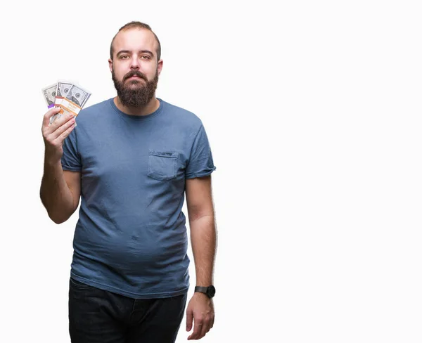 Joven Hipster Hombre Sosteniendo Montón Dinero Sobre Fondo Aislado Con —  Fotos de Stock