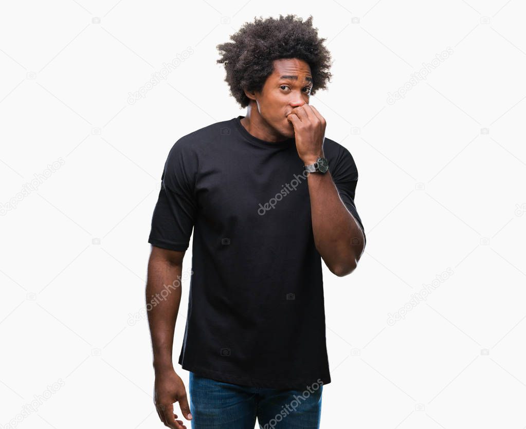 Afro american man over isolated background looking stressed and nervous with hands on mouth biting nails. Anxiety problem.