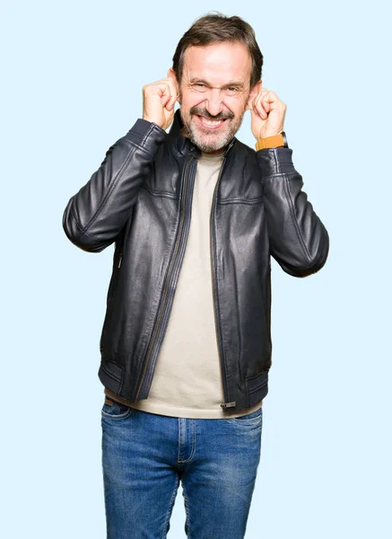 Middle Age Handsome Man Wearing Black Leather Jacket Covering Ears — Stock Photo, Image