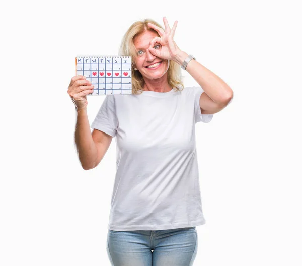 Blonde Vrouw Van Middelbare Leeftijd Menstruatie Kalender Ver Houden Geïsoleerd — Stockfoto