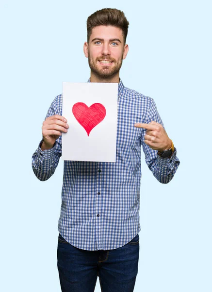 Young Handsome Man Holding Paper Red Heart Very Happy Pointing — Stock Photo, Image
