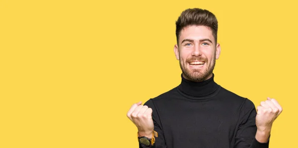 Young Handsome Blond Man Wearing Winter Sweater Celebrating Surprised Amazed — Stock Photo, Image