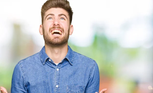 Young Handsome Blond Man Wearing Casual Denim Shirt Crazy Mad — Stock Photo, Image