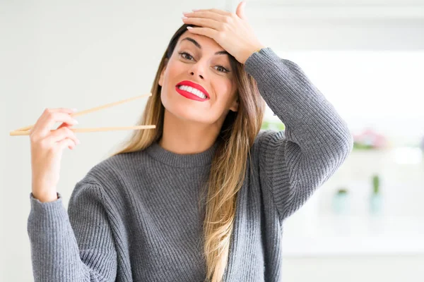 Young Beautiful Woman Holding Asian Chopsticks Home Stressed Hand Head — Stock Photo, Image